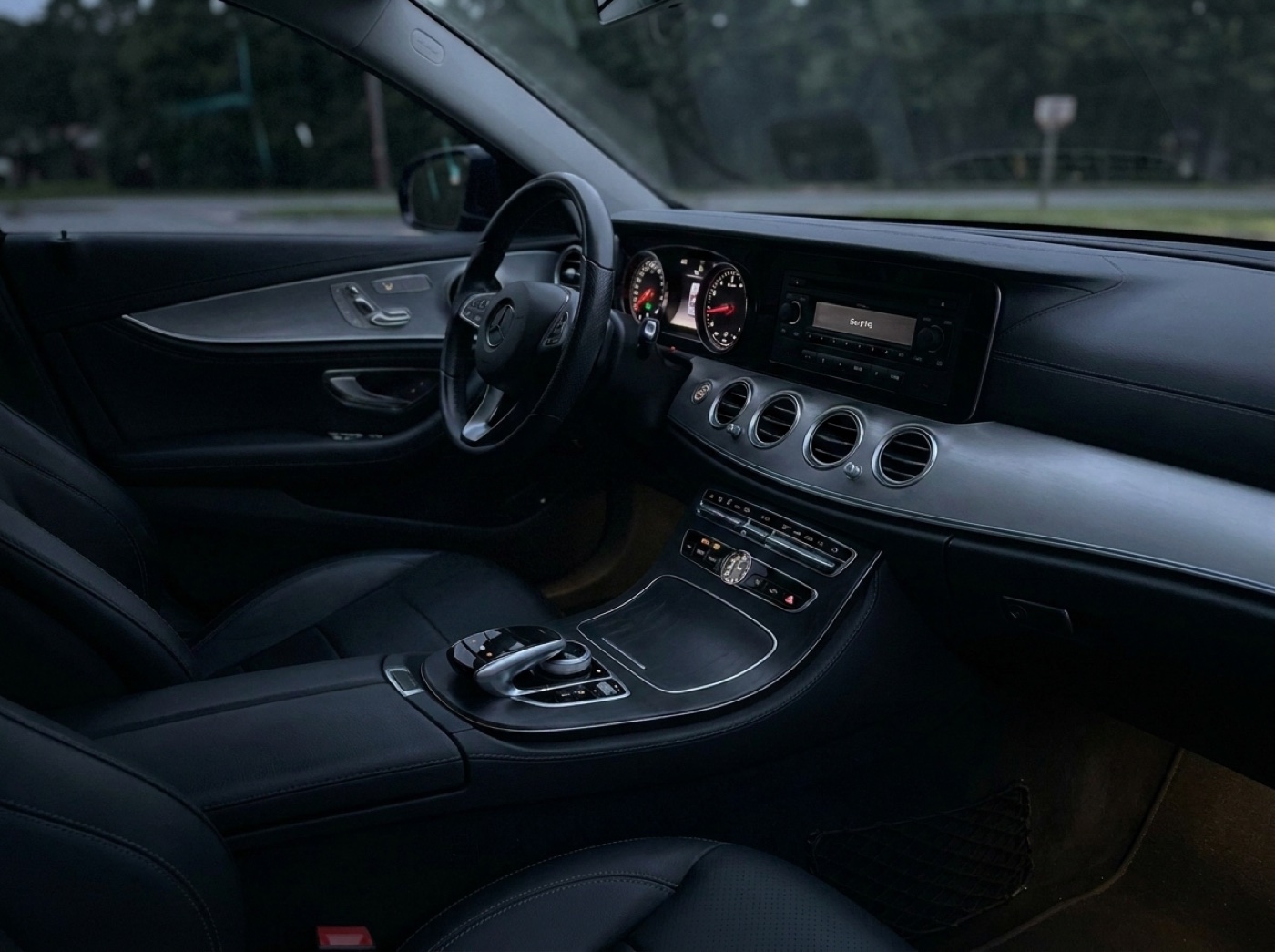 Stock car dashboard with a basic factory radio before the upgrade